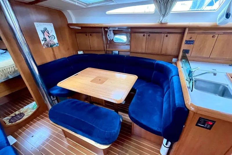 Slide: The Image of 2005 Jeanneau Sun Odyssey 40.3 sailboat docked, showcasing deck and cockpit area. - 10