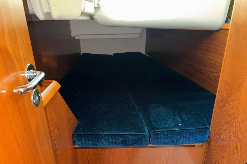 Slide: The Image of 2005 Jeanneau Sun Odyssey 40.3 sailboat docked, showcasing deck and rigging. - 12