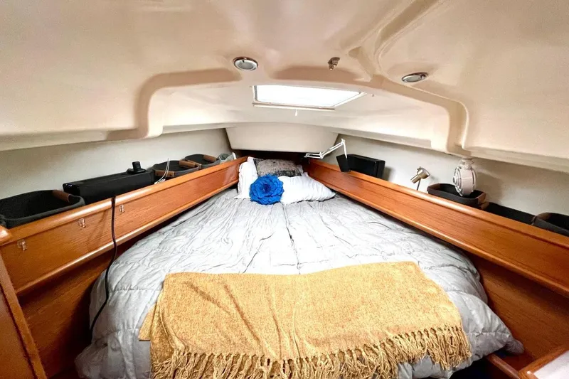 Slide: The Image of 2005 Jeanneau Sun Odyssey 40.3 sailboat docked, showcasing deck and rigging details. - 13