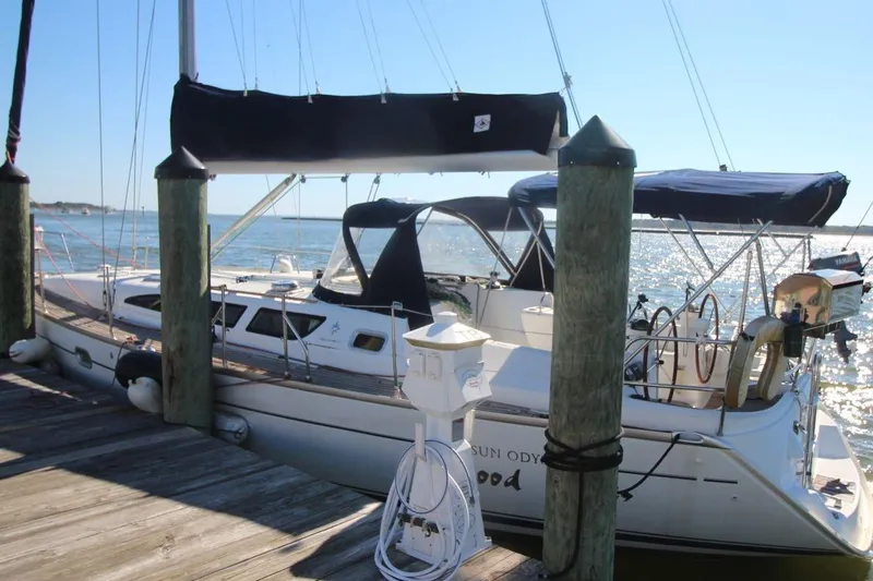 Slide: The Image of 2005 Jeanneau Sun Odyssey 40.3 sailboat docked by the water on a sunny day. - 15