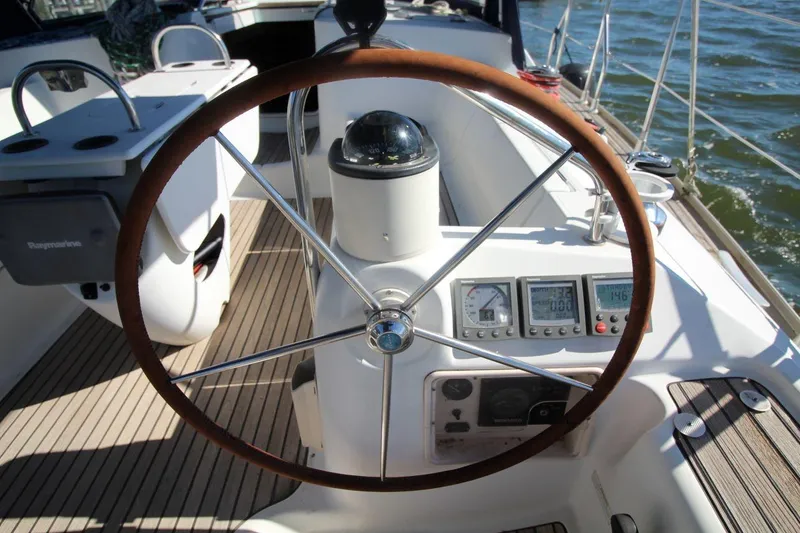 Slide: The Image of Steering wheel and controls of a 2005 Jeanneau Sun Odyssey 40.3 sailboat. - 17