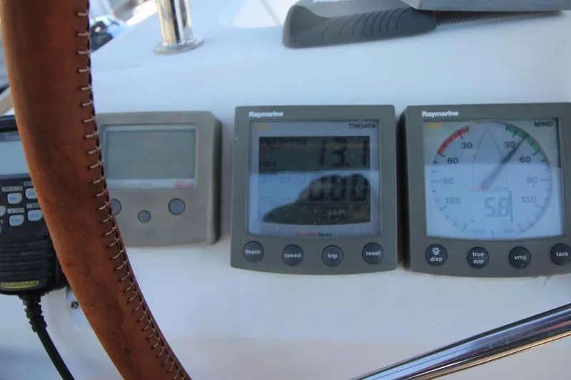 Slide: The Image of Steering wheel and navigation instruments on 2005 Jeanneau Sun Odyssey 40.3 sailboat. - 19