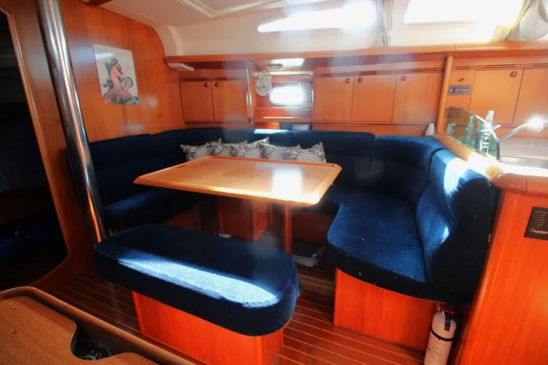 Slide: The Image of Interior of 2005 Jeanneau Sun Odyssey 40.3 sailboat with cozy seating and wooden finishes. - 23