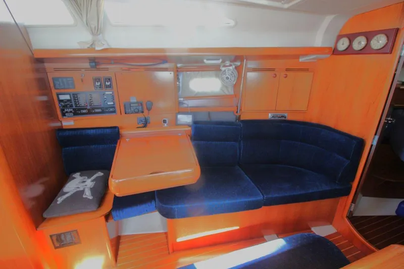 Slide: The Image of Interior of 2005 Jeanneau Sun Odyssey 40.3 yacht with blue seating and control panel. - 24