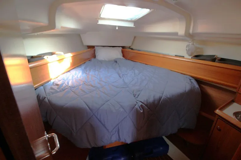Slide: The Image of Cozy cabin interior of 2005 Jeanneau Sun Odyssey 40.3 with a comfortable bed. - 30
