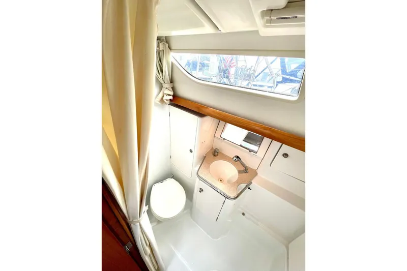 Slide: The Image of Bathroom interior of 2005 Jeanneau Sun Odyssey 40.3 sailboat, featuring sink and toilet. - 33