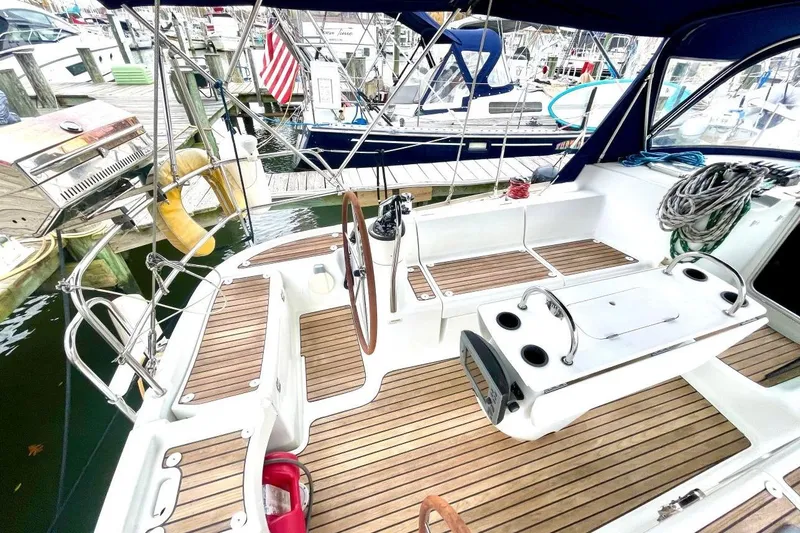 Slide: The Image of 2005 Jeanneau Sun Odyssey 40.3 sailboat docked in marina, named "Good Times." - 6