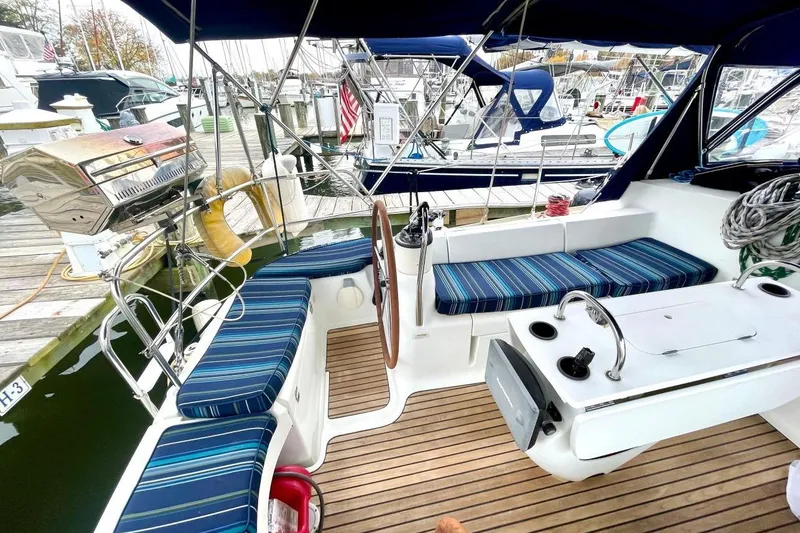 Slide: The Image of 2005 Jeanneau Sun Odyssey 40.3 sailboat docked at a marina. - 7