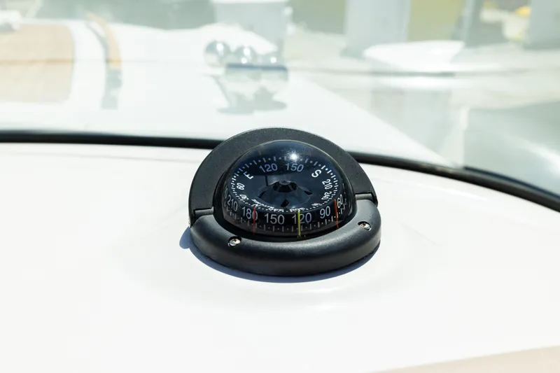 Slide: The Image of Compass on 2007 Chris Craft Corsair boat dashboard, close-up view. - 10