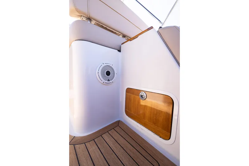 Slide: The Image of 2007 Chris Craft Corsair interior with wood accents and speaker detail. - 11