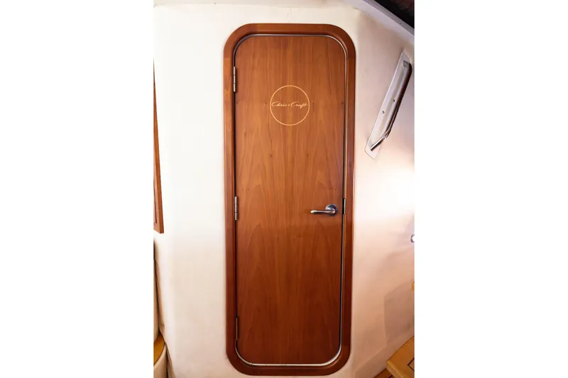 Slide: The Image of Wooden cabin door on 2007 Chris Craft Corsair boat interior. - 13