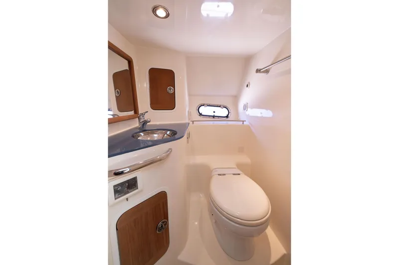 Slide: The Image of Luxurious 2007 Chris Craft Corsair bathroom with modern fixtures and elegant wood accents. - 14