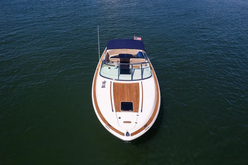 Slide: The Image of 2007 Chris Craft Corsair boat on calm water, aerial view. - 19