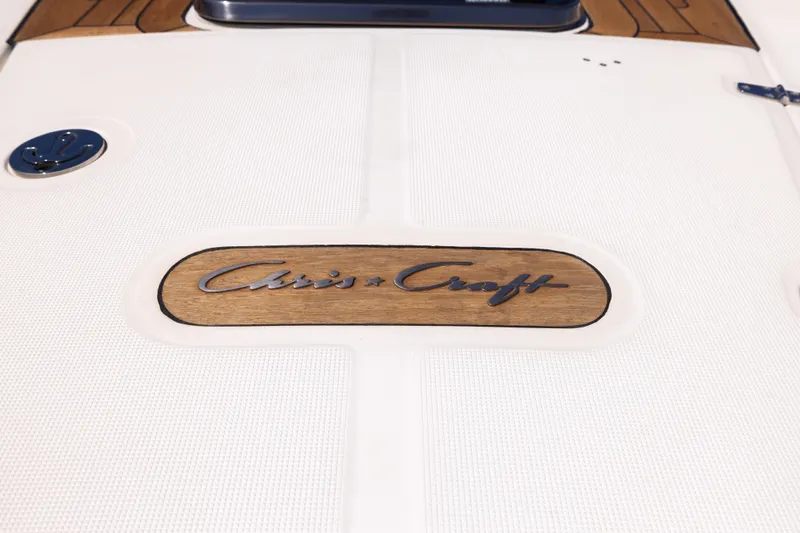 Slide: The Image of 2007 Chris Craft Corsair boat deck with logo on white surface. - 23