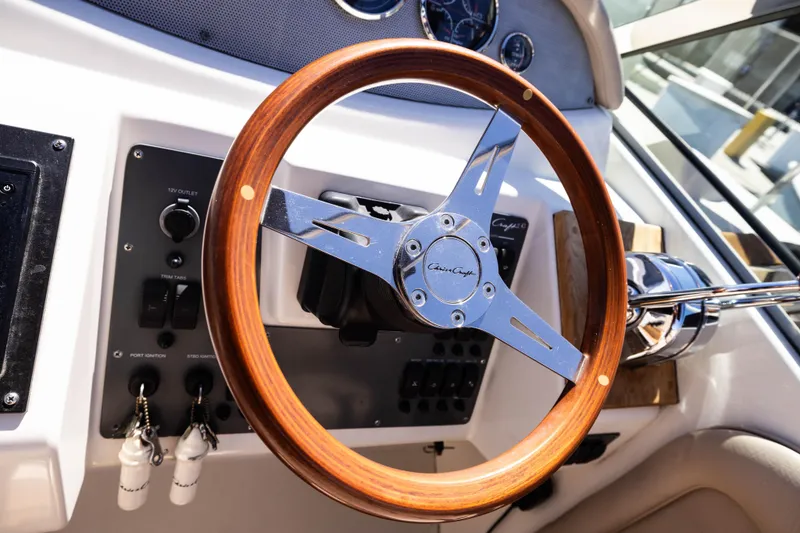 Slide: The Image of 2007 Chris Craft Corsair steering wheel with wood and chrome accents. - 7