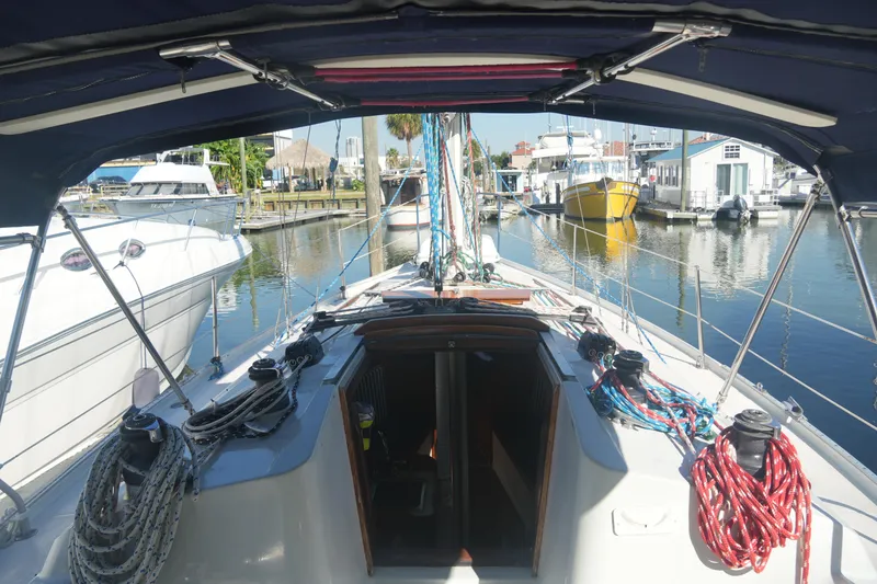 Slide: The Image of Cockpit view of 1987 Ericson 32-200 sailboat docked in a marina. - 10