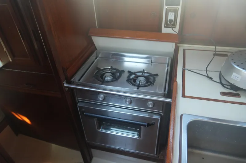 Slide: The Image of Stainless steel stove and oven in 1987 Ericson 32-200 yacht kitchen. - 23