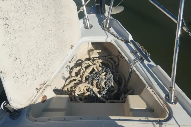 Slide: The Image of Anchor locker of 1987 Ericson 32-200 sailboat with ropes and chain. - 6