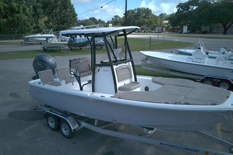 Slide: The Image of 2026 Sea Hunt BX 22 boat on trailer, parked outdoors, featuring Yamaha engine. - 4