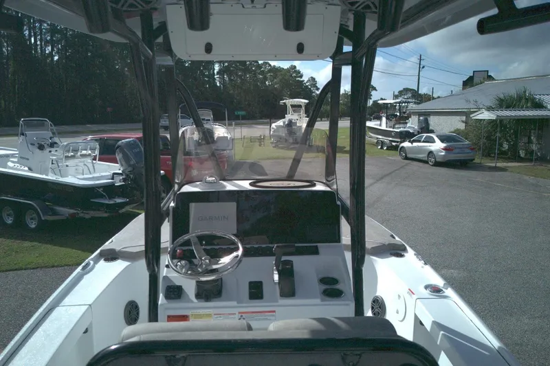 Slide: The Image of 2026 Sea Hunt BX 22 boat interior with steering wheel and Garmin display. - 7