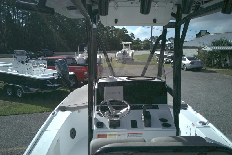 Slide: The Image of 2026 Sea Hunt BX 22 boat interior with steering wheel and Garmin navigation system. - 8
