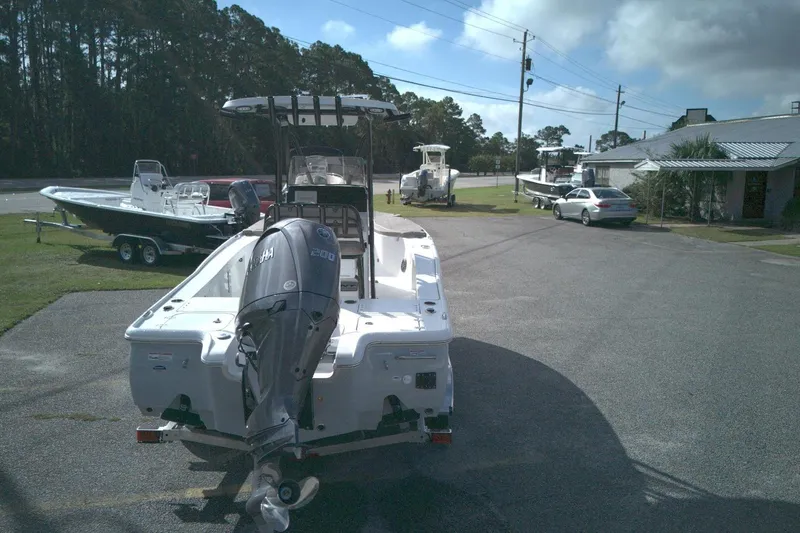 Slide: The Image of 2026 Sea Hunt BX 22 boat with Yamaha engine in a parking lot. - 9