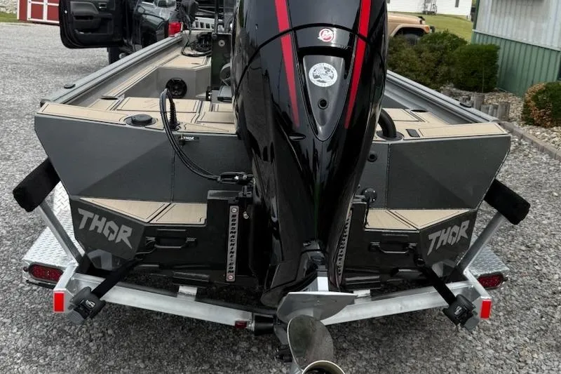 Slide: The Image of 2026 Thor LAKE HAMMER 1900 CC boat with powerful outboard motor on trailer. - 2