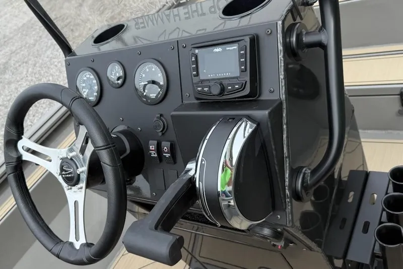 Slide: The Image of 2026 Thor LAKE HAMMER 1900 CC boat dashboard with steering wheel and controls. - 6