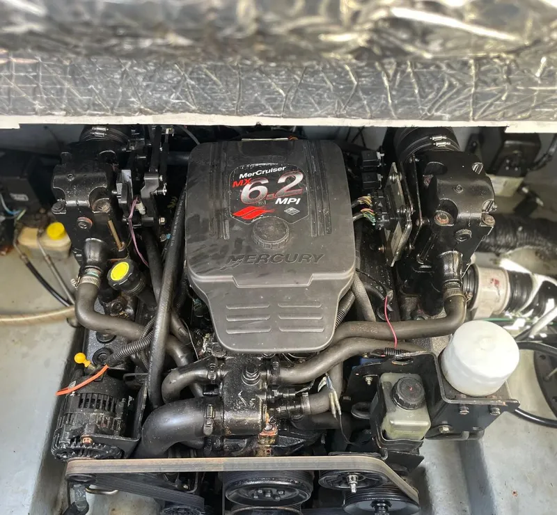 Slide: The Image of Engine of a 2004 Sea Ray 260 Sundancer boat, featuring a MerCruiser 6.2 MPI. - 13