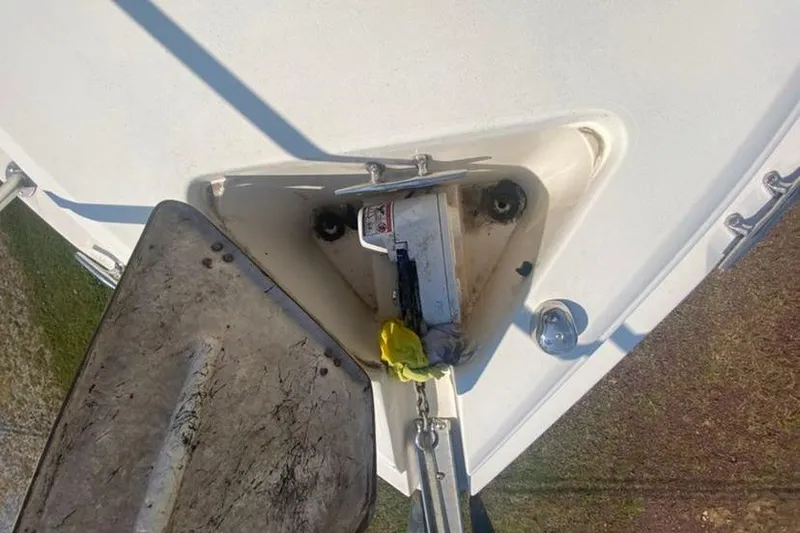 Slide: The Image of Anchor compartment of a 2001 Rinker 310 Fiesta Vee boat, showing anchor and chain. - 18