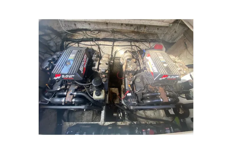 Slide: The Image of Engine compartment of a 2001 Rinker 310 Fiesta Vee with twin Mercury 5.0L engines. - 19