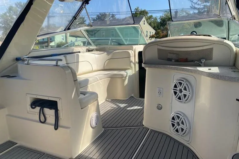 Slide: The Image of 2001 Rinker 310 Fiesta Vee boat interior with seating and speakers. - 6