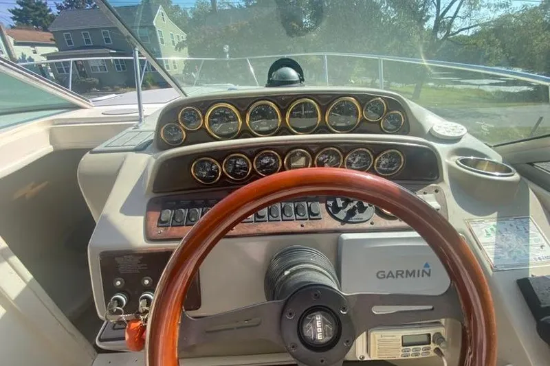 Slide: The Image of 2001 Rinker 310 Fiesta Vee boat dashboard with Garmin navigation system. - 9