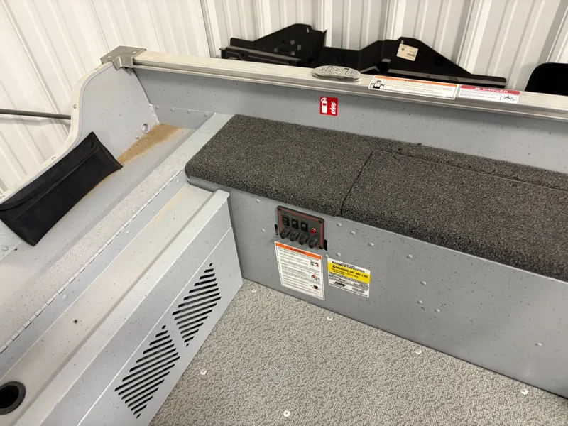 Slide: The Image of Interior of 2025 Lund 1400 Fury Tiller with gray carpet flooring. - 6