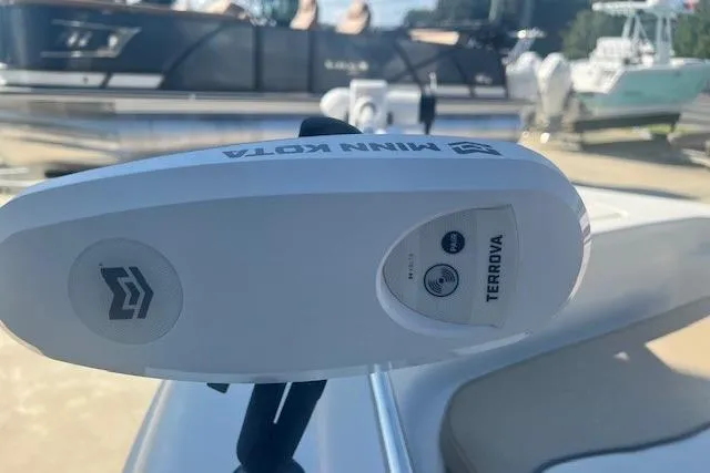 Slide: The Image of Minn Kota Terrova motor on 2020 Key West 189 FS boat, docked with other boats nearby. - 11