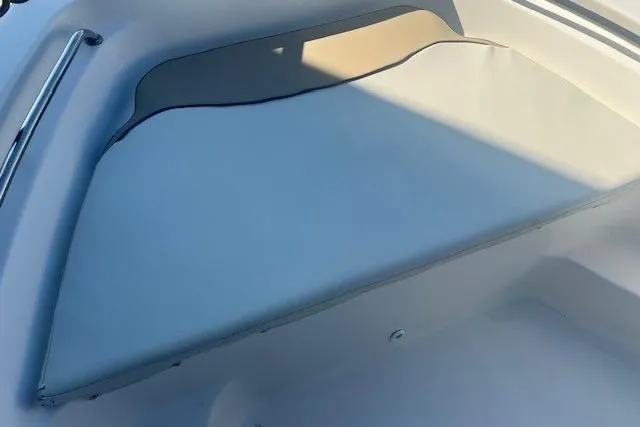 Slide: The Image of 2020 Key West 189 FS boat interior with cushioned seating and stainless steel railing. - 12