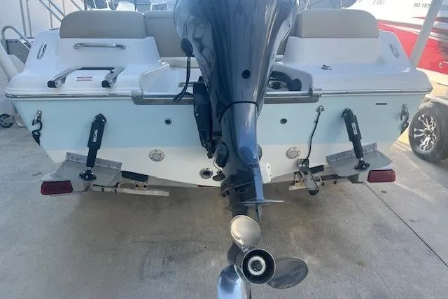 Slide: The Image of 2020 Key West 189 FS boat rear view with outboard motor and trim tabs. - 3