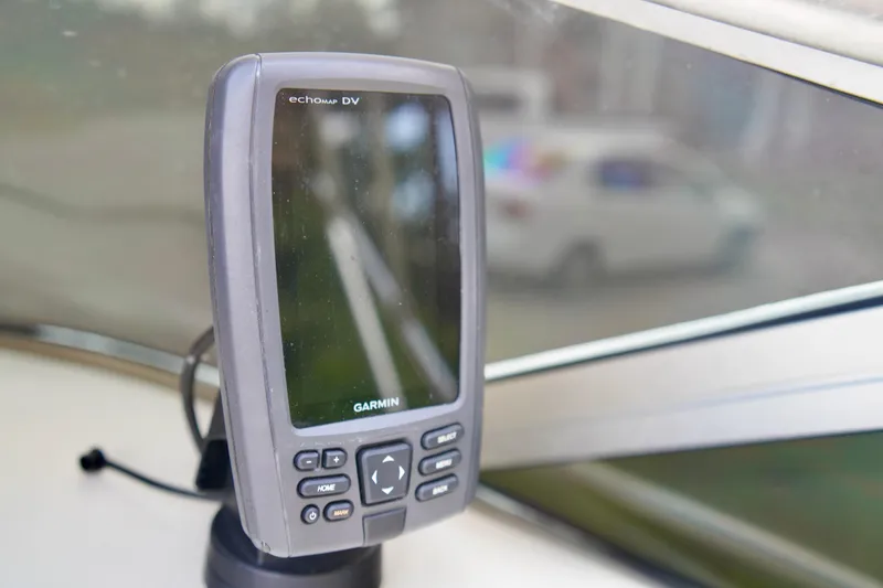 Slide: The Image of Garmin echomap DV on 2001 Sea Ray 215 Express Cruiser dashboard. - 13