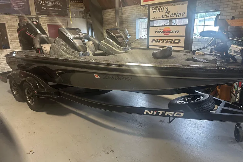 Slide: The Image of 2020 Nitro Z19 Pro bass boat in showroom, displayed on trailer. - 1