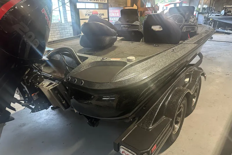 Slide: The Image of 2020 Nitro Z19 Pro boat in showroom, featuring sleek design and powerful engine. - 11