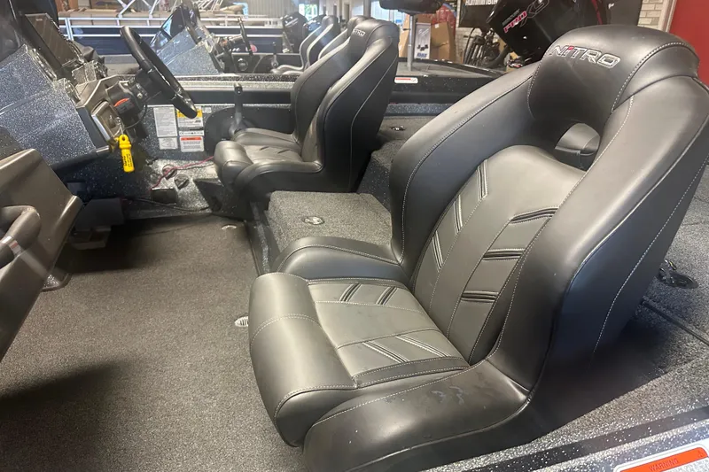 Slide: The Image of Interior of a 2020 Nitro Z19 Pro boat with black leather seats. - 7
