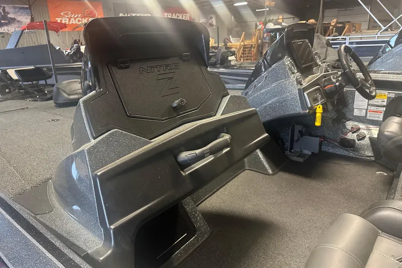 Slide: The Image of 2020 Nitro Z19 Pro boat interior with steering wheel and storage compartments. - 8