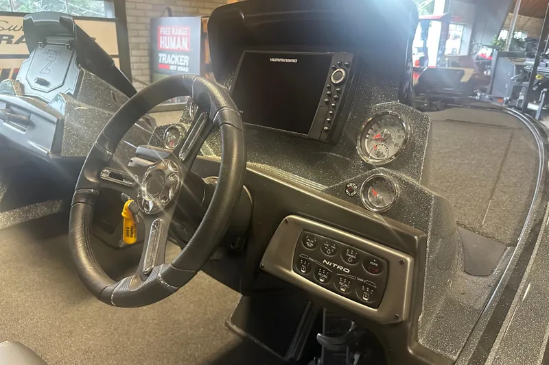 Slide: The Image of 2020 Nitro Z19 Pro boat dashboard with steering wheel and control panel. - 9