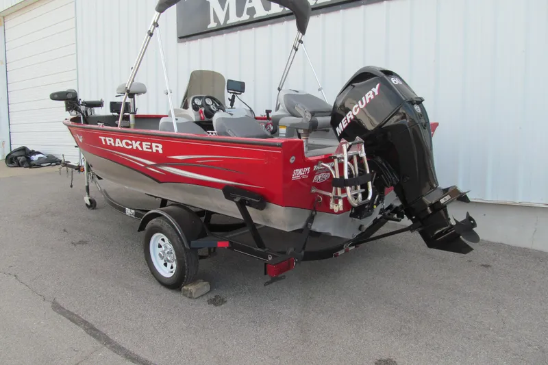 Slide: The Image of 2012 Tracker Pro Guide V-16 SC boat with Mercury engine on trailer. - 3