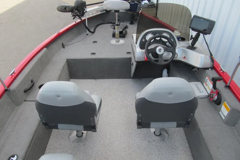 Slide: The Image of 2012 Tracker Pro Guide V-16 SC boat interior with steering console and seating. - 5