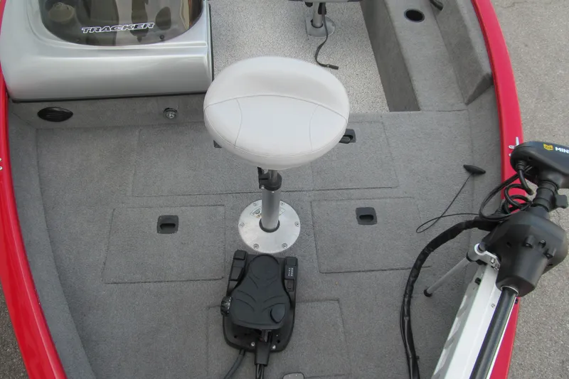 Slide: The Image of 2012 Tracker Pro Guide V-16 SC boat interior with seat and trolling motor. - 8