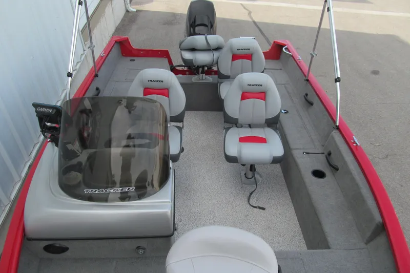 Slide: The Image of 2012 Tracker Pro Guide V-16 SC boat interior with seating and Garmin equipment. - 9