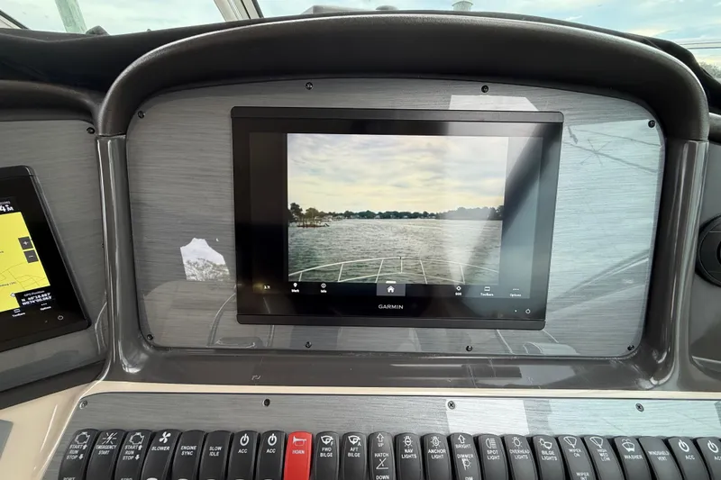 Slide: The Image of Garmin navigation display on 2007 Sea Ray 40 Sundancer yacht dashboard. - 11
