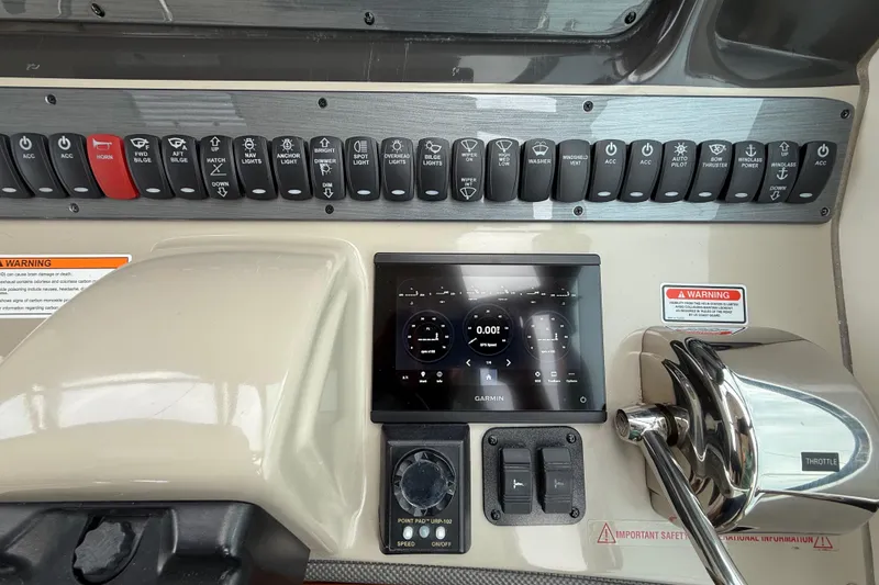Slide: The Image of Control panel of a 2007 Sea Ray 40 Sundancer boat with Garmin display. - 12