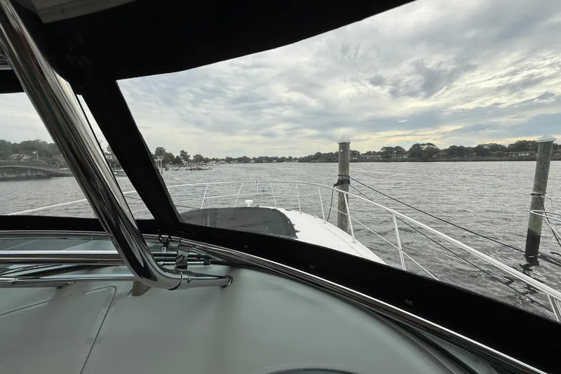 Slide: The Image of View from 2007 Sea Ray 40 Sundancer yacht, overlooking calm waters and cloudy sky. - 14